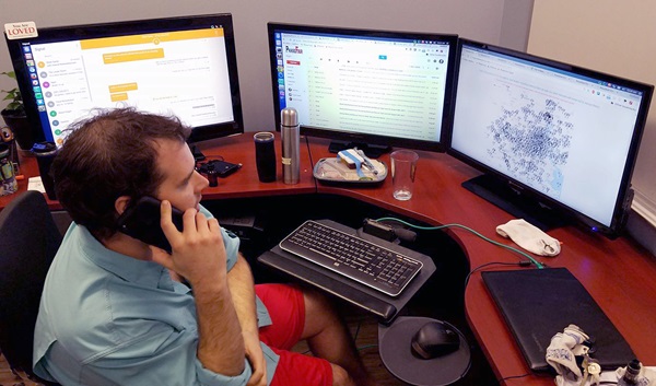 matthew-marchetti-houstonharveyrescue-2017-edited2 Matthew Marchetti, a member of Chapelwood United Methodist Church in Houston, looks at three computer screens as he works to locate people who need rescuing during Hurricane Harvey. Marchetti, along with fellow Chapelwood member Oliver Carter, came up with a design for a web app, HoustonHarveyRescue.com, to help connect those in need with volunteer rescuers. Photo courtesy of Matthew Marchetti.