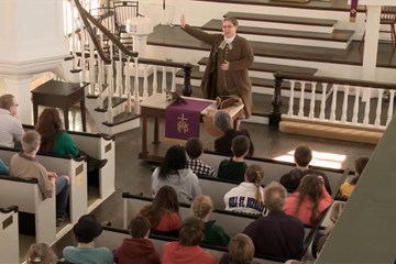 Actor portrays the Rev. Simon Blessing, an itinerant Methodist minister from the 1700s. Video image by Chris Foster. 