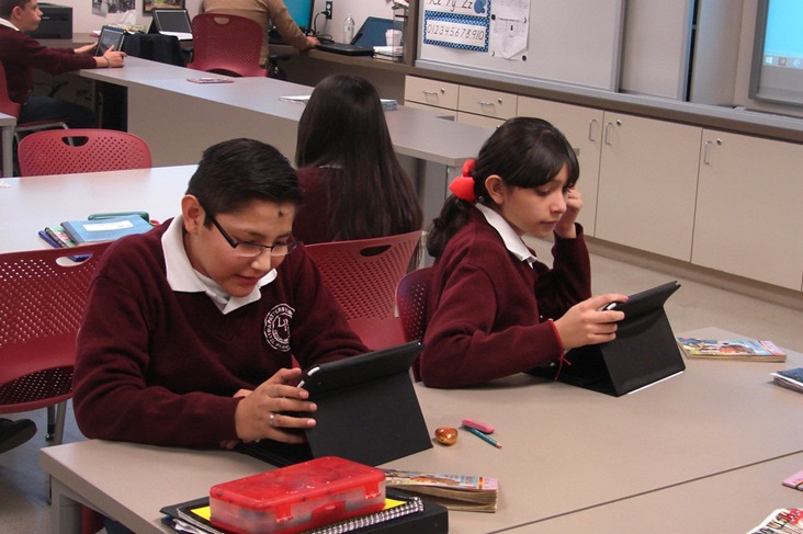 Lydia Patterson Institute has lately added tablet computers, but many needs remain, including for a functioning science lab. Photo by Sam Hodges, United Methodist Communications. Students work with tablet computers.