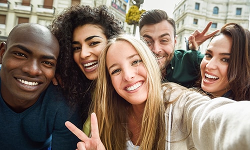Group of young people taking a selfie.