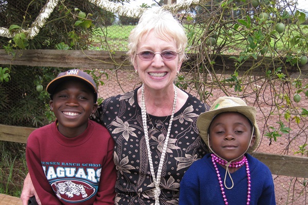 Kay 'Bibi Kay' Oursler sits with two children who live at Sunrise Children's Home in Tanzania, the orphanage Oursler founded. Photo courtesy of Kay Oursler. Kay 'Bibi Kay' Oursler sits with two children who live at Sunrise Children's Home in Tanzania, the orphanage Oursler founded. Photo courtesy of Kay Oursler.