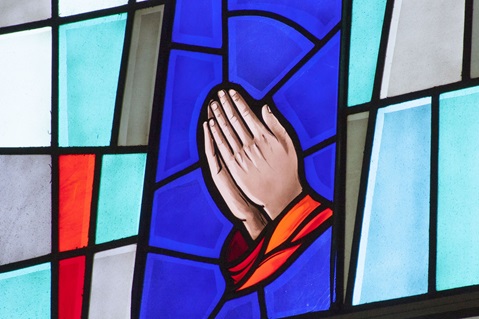 Stained glass window of hands praying. Photo by Jan Snider, United Methodist Communications. Stained glass window of hands praying. Photo by Jan Snider, United Methodist Communications.