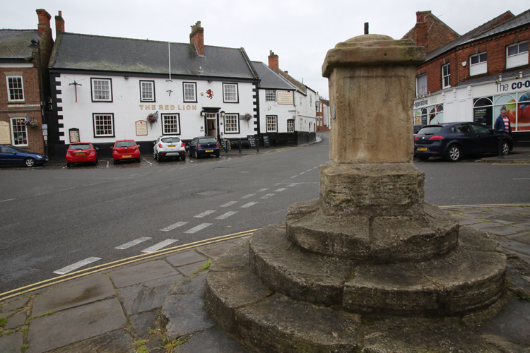 John Wesley preached from these steps at The Market Cross in the heart of Epworth. Photo by Kathleen Barry, United Methodist Communications.