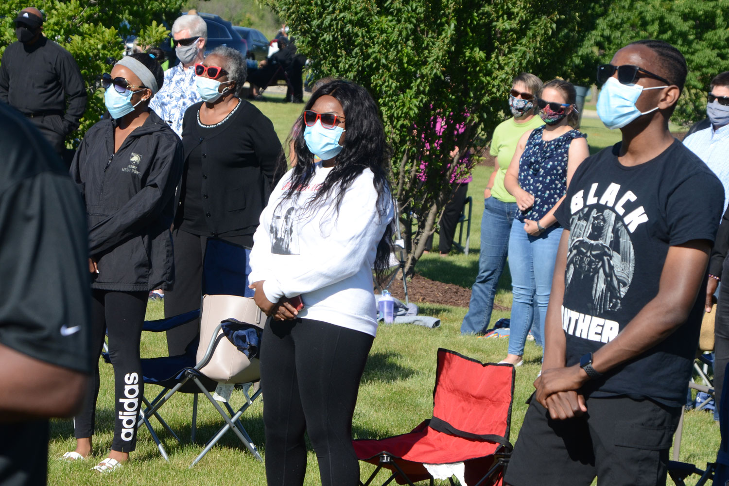 Worshippers join in a song during an outdoor service entitled "A Call to Prayer for Social Justice, Reconciliation and Healing" at St. John AME Church in Aurora, Ill. File photo by Al Benson.