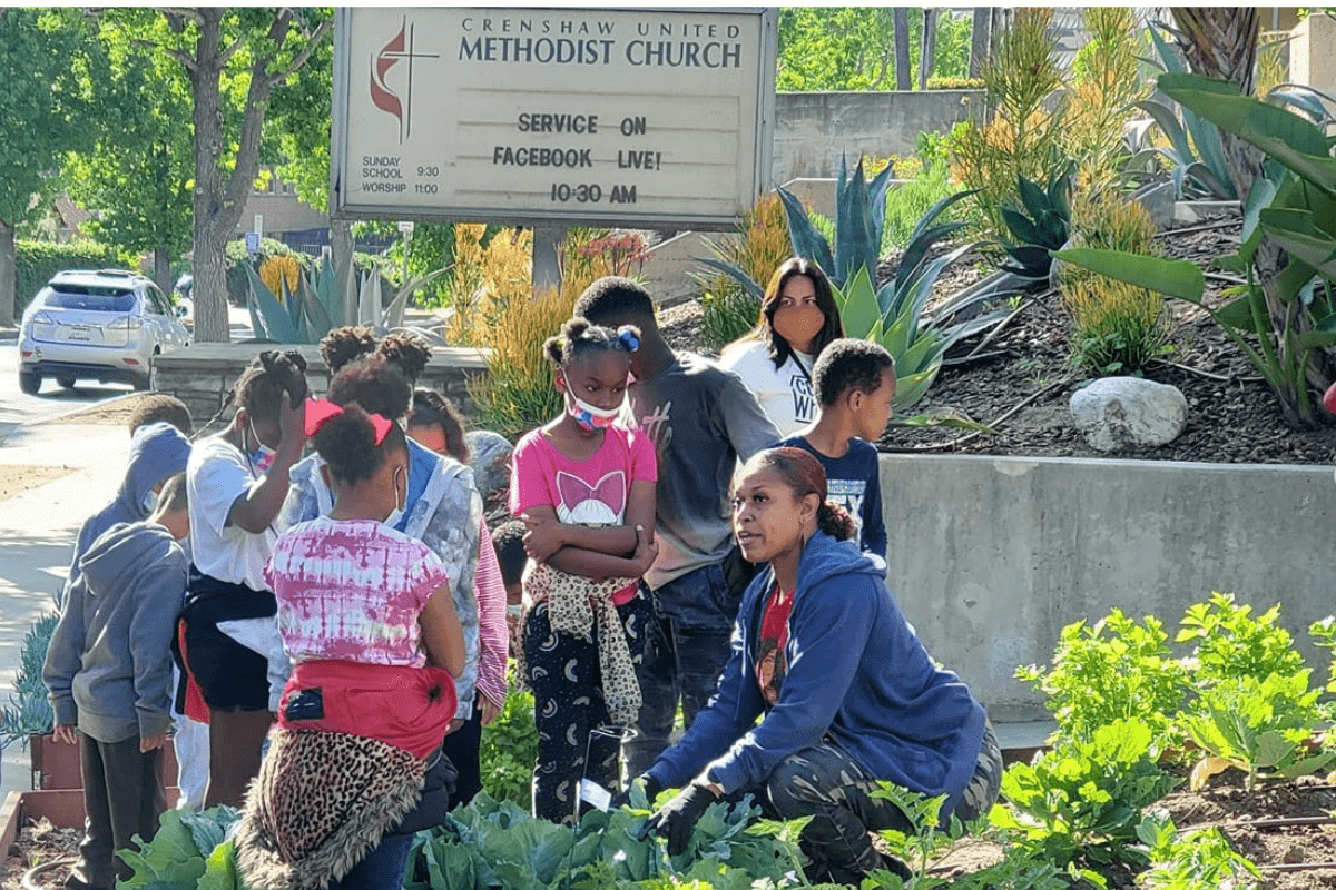 Joi Nichols (far right) serves as the master gardener for Crenshaw UMC in Los Angeles. The church's community outreach addresses hunger among its neighbors with a garden, food box deliveries and other ministries. Photo courtesy of Crenshaw UMC.