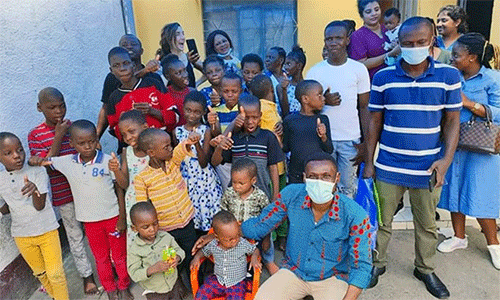 Innocent Afful, a missionary with the United Methodist Board of Global Ministries, poses with children from a church-supported orphanage in Kinshasa, Congo. Funding from a Global Ministries Advance project teaches orphans vocational skills. Photo courtesy of Innocent Afful.