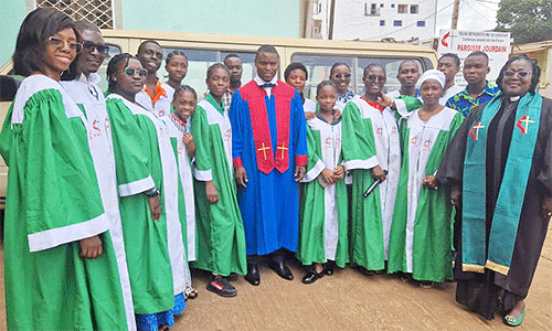 Carlito Alberto (in blue robe) sings with the choir of the Jourdain UMC in Jourdain, Cameroon. (Photo: Courtesy of Carlito Alberto)