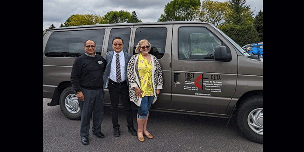 Angel (right) and Lourdes (left) Franco stand beside Rev. Dr. Woojae Im (center), their district superintendent. Im was their connection to the Korean church that donated funds for the van.