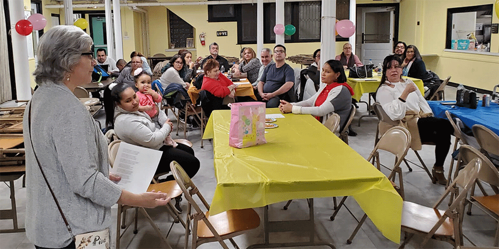Rev. Lisa DePaz (left) with migrants and church members hosted at Haws Ave. UMC in Norristown, PA. Receipent of 2023 Mustard Seed Migration Grant. (Photo: Courtesy of Haws Ave. UMC)