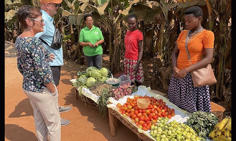 Rev. John Legg and his wife, Latrice, visit a market made possible by Zoe Empowers in a remote Rwanda village.