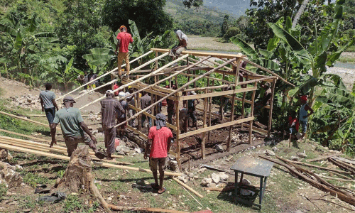Volunteers of Jeremie Rising frame a shelter for a family home. This joint venture project with Next Generation costs about $3,000 and takes a week to build. The goal is to erect 20 such structures every year. ~ photo courtesy Jeremie Rising