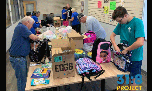 Members of McCabe UMC fill Bravery Backpacks for the 31:8 Project.
