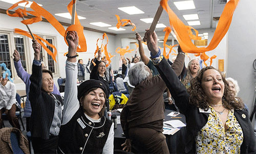 Members of the United Women in Faith Program Advisory Group celebrate the announcement of Assembly 2026, scheduled for May 15-17, 2026, in Indianapolis. Pictured in the foreground are board member Marilyn Sanchez Reid of the Western Jurisdiction and Vice President Heidi Careaga of the North Central Jurisdiction. Photo by Mike DuBose, UM News.
