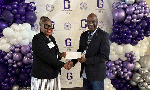 Gammon President Dr. Candace Lewis shakes hands with James H. Salley, President & Chief Executive Officer of Africa University, Inc. and Associate Vice Chancellor for Institutional Advancement, Africa University as he presents a check of his generous donation
