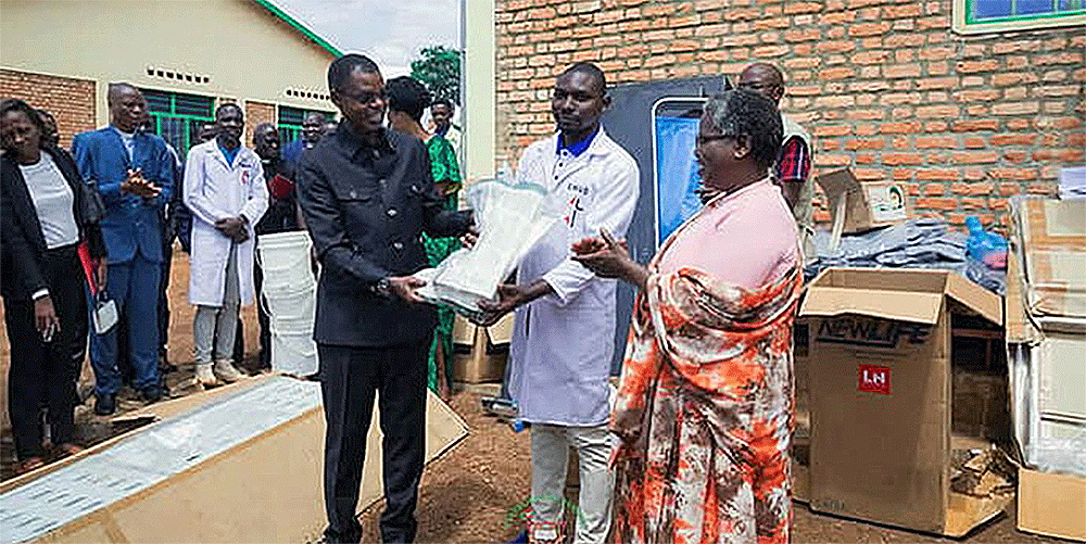 In the center, Niyoyankunze Philemon, head of the health center, and Bishop Emmanuel Sinzohagera (left) receive medical equipment from Dr. Lyduine Baradahana (left), Burundi health minister. This donation is part of a shared commitment to improving the quality of care provided in Gahambwe. Photo by Jérôme Ndayisenga, UM News.